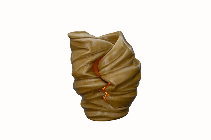 Light Ceramic Urn sculptural candle holder in warm brown glaze with a glowing interior.